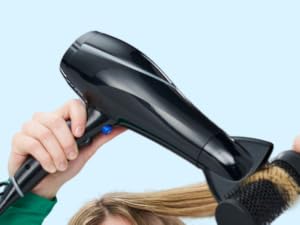 Woman drying hair