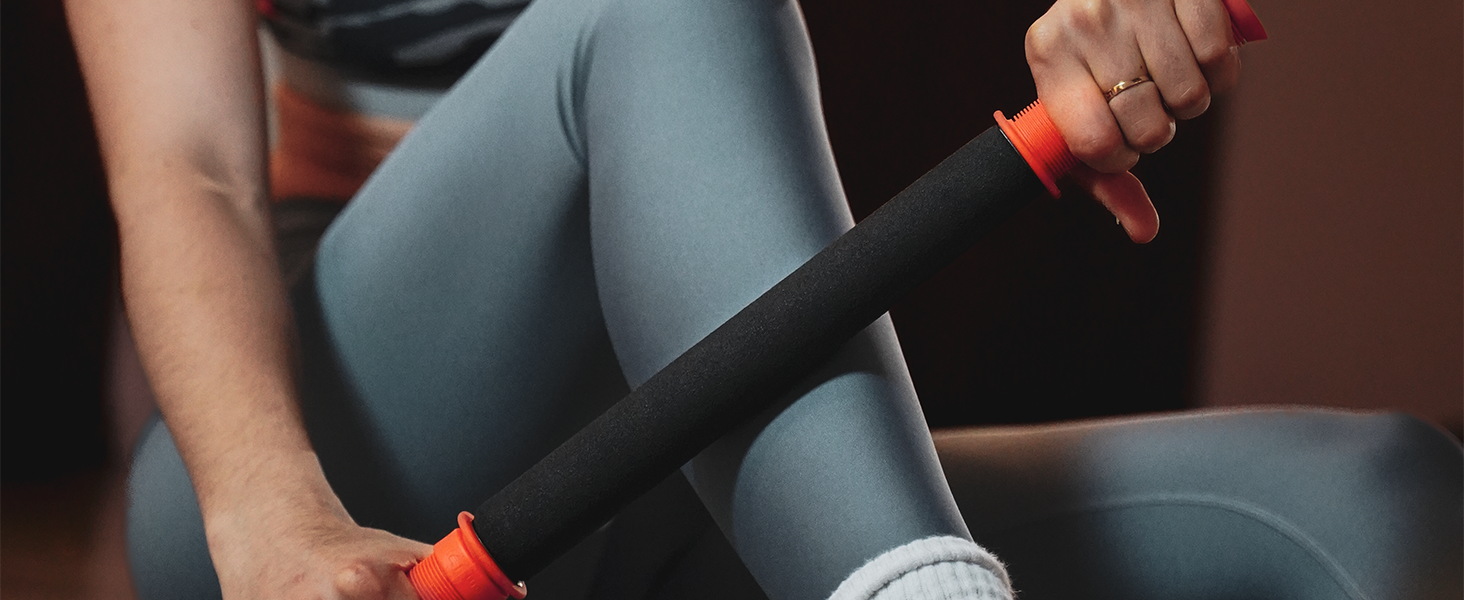 muscle recover through the use of a massage stick on leg, the stick, hand held foam roller, soreness