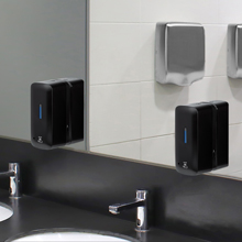 EnBath wall mounted automatic soap dispenser installed above sink in modern commercial restroom