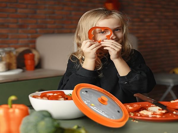 orange splatter cover and a girl holding a tomato