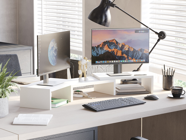a desk with a computer monitor and a keyboard