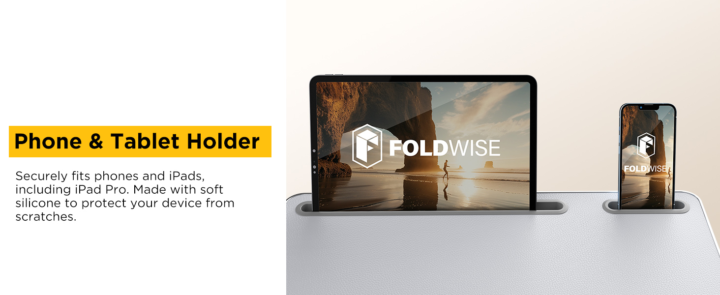 Tablet and phone upright in silicone slots on textured surface of lap desk for devices.