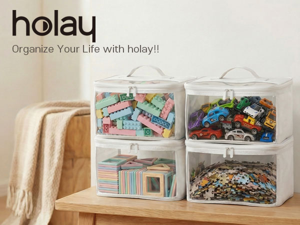Clear toy storage bags holding blocks, toy cars, puzzles,on a wooden table