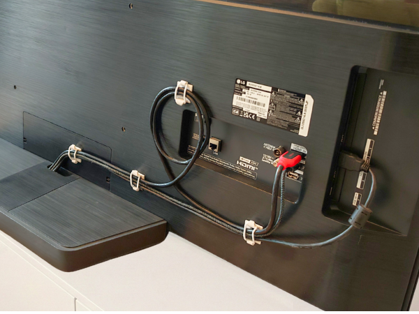 Cables secured behind TV.