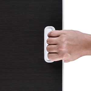 a person opening a door with a white handle.