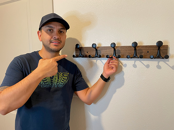 This boy is super happy to own this wall coat hook for decorations and clothes