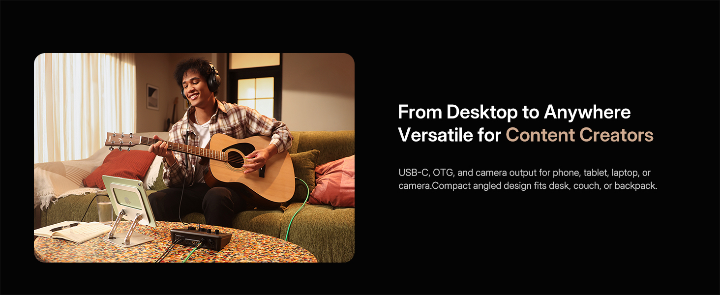 Music creator playing guitar recording music on couch with portable Maono P2 audio interface