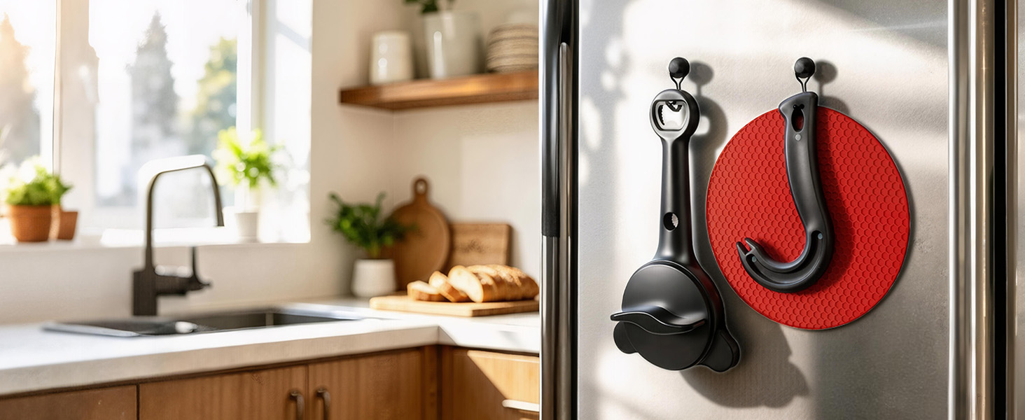 Two black magnetic hooks organizing kitchen opening tools on side of stainless steel refrigerator.
