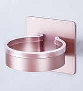 Product image showing rose gold circular towel holder or ring mounted on wall, demonstrating modern bathroom hardware design.