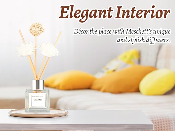 Text reads 'Elegant Interior' and 'Decor the place with Meselett's unique and stylish diffusers.' Product photography of glass diffuser or fragrance container on wooden surface with yellow decor elements.