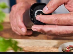 Salt and pepper grinder with batteries included