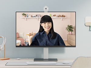 brio 300 full hd webcam off-white attached to a monitor