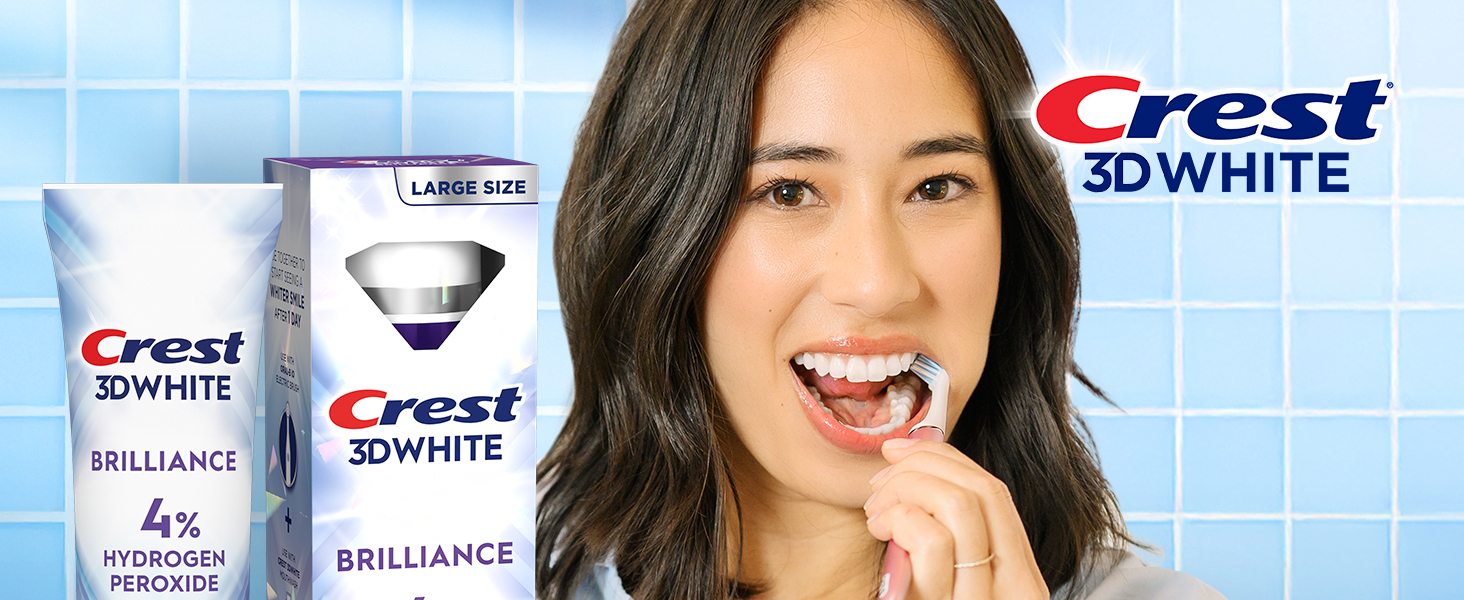 Happy woman brushing her teeth with Crest 3DWhite.