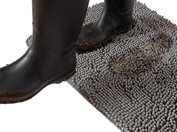 muddy boots walking across absorbent gray doormat