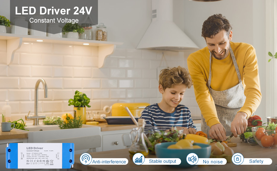 a man and a young boy in the kitchen preparing food.