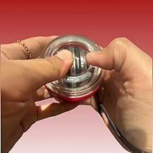 a hand holding a can of soda