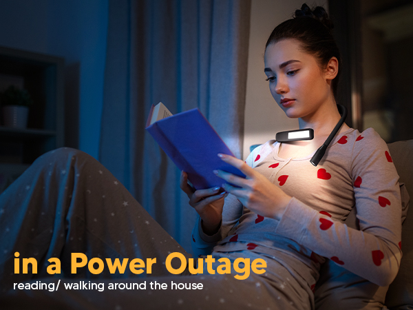 A young woman is studying bible during a power outage with EastPin reading light neck book light on