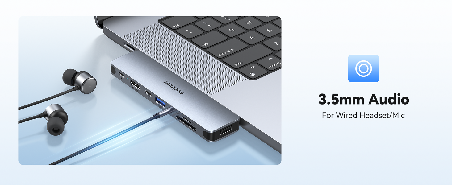 Close-up of laptop's 3.5mm audio port with connected earbuds, showing details of the headphone jack interface.