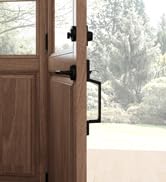 Modern oak entryway door with matte black handleset and deadbolt lockset.