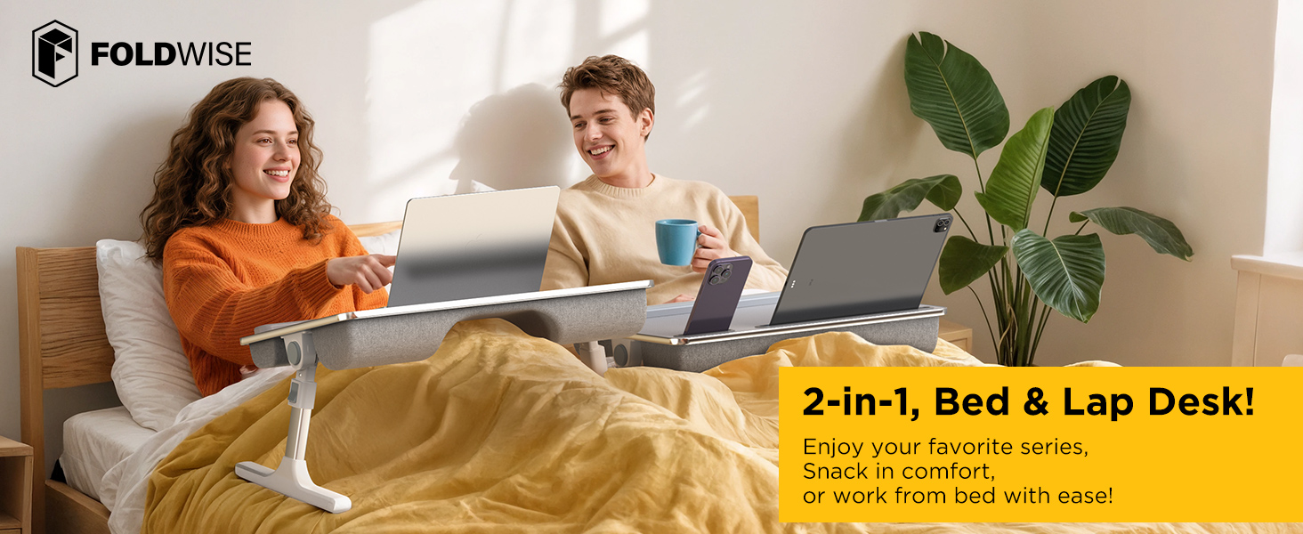 Couple using adjustable bed laptop desk with devices for remote work and leisure in bed