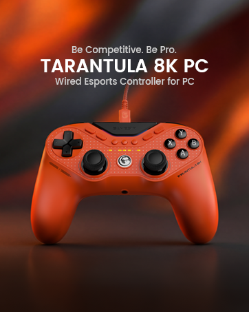 Text reads "TARANTULA 8K PC" and "Wired Gamepad For PC". Orange gaming controller with textured grip, multiple buttons, analog sticks, and D-pad displayed against dark background.