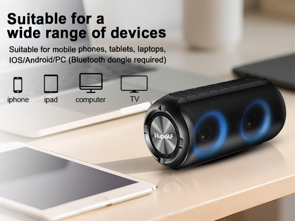 Text reads 'Suitable for a wide range of devices'. Product demonstration showing black charging cable compatible with multiple electronic devices on wooden surface.
