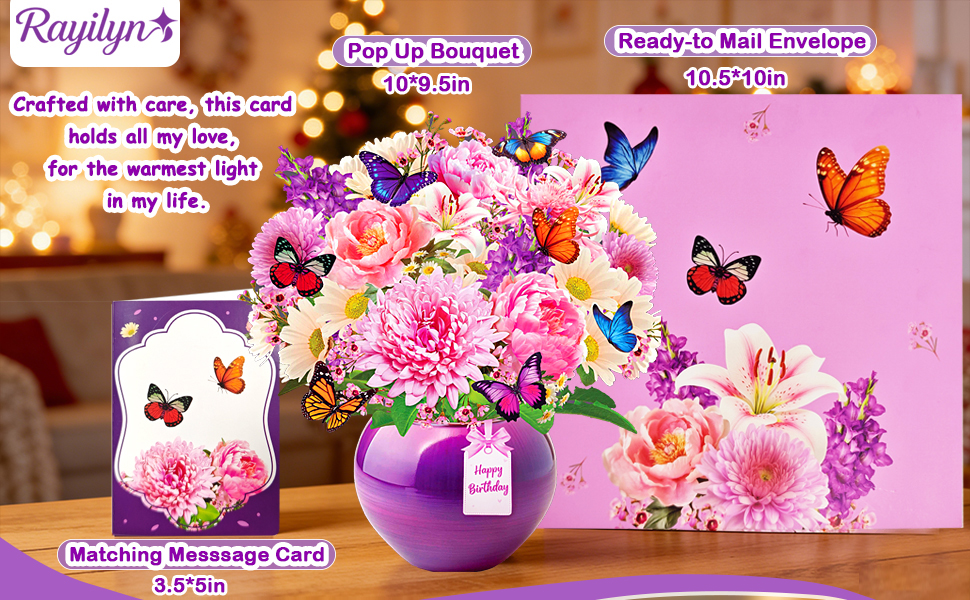 Text reads 'Raylyn's' with product names 'Rose Hip Bouquet' and 'Raylyn's Mist Lavender' visible. Floral arrangement with flowers, butterflies, purple vase, and fragrance product cards on pink background.