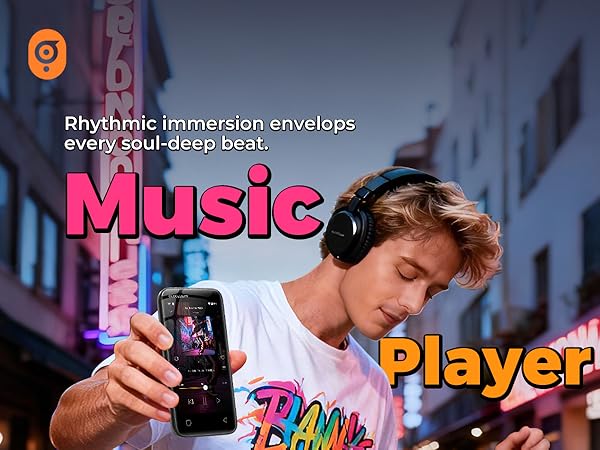 Man enjoying music with headphones while holding a Globluum MP3 player in a neon city street.