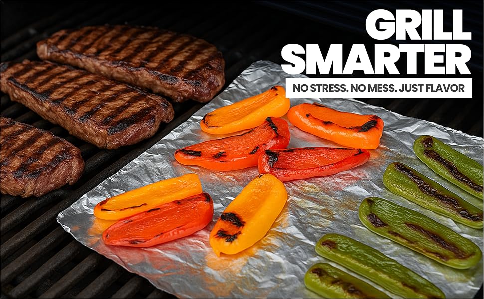 Grilled vegetables on heavy-duty foil sheet beside steaks on a barbecue grill.