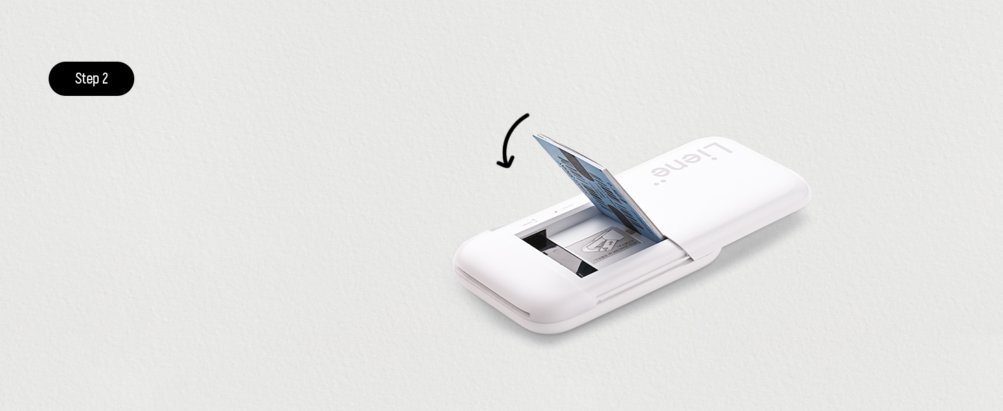 White electronic device shown in profile, demonstrating paper or card insertion through a slot with a curved arrow indicating direction.