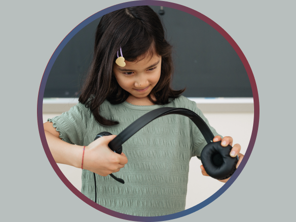 Two children attempting to pull apart a Cyber Acoustics headset