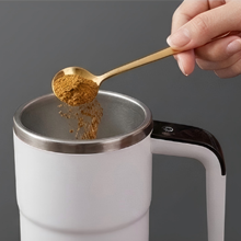 Self stirring coffee cup