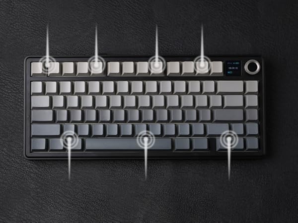 a computer keyboard with a gray and black keyboard on a black background.