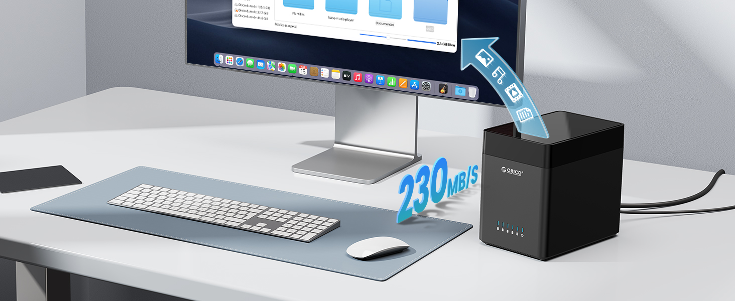 Desktop setup with computer monitor, keyboard, mouse, and small black device. Blue hologram-like text '230 m/s' floats above desk.