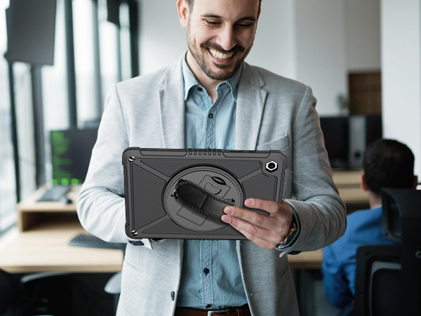 Professional setting showing tablet device being used. Person in business attire interacting with tablet while standing.