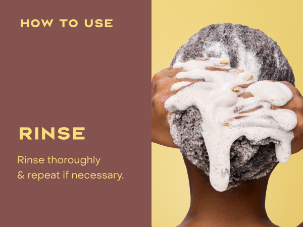 Image of a woman with curly hair rinsing it.
