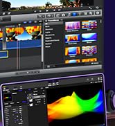 Dual-monitor setup displaying video editing software interface with timeline, preview window, and audio waveform graph.