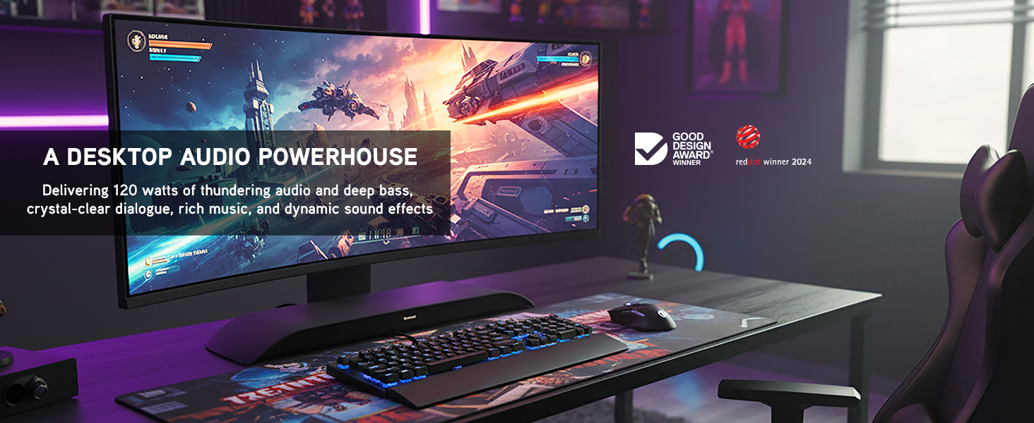 Desktop gaming setup with widescreen monitor and slim soundbar delivering powerful audio underscreen