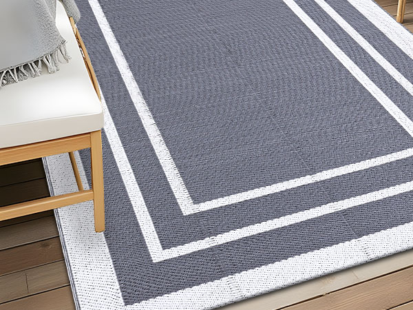 grey and white outdoor rug
