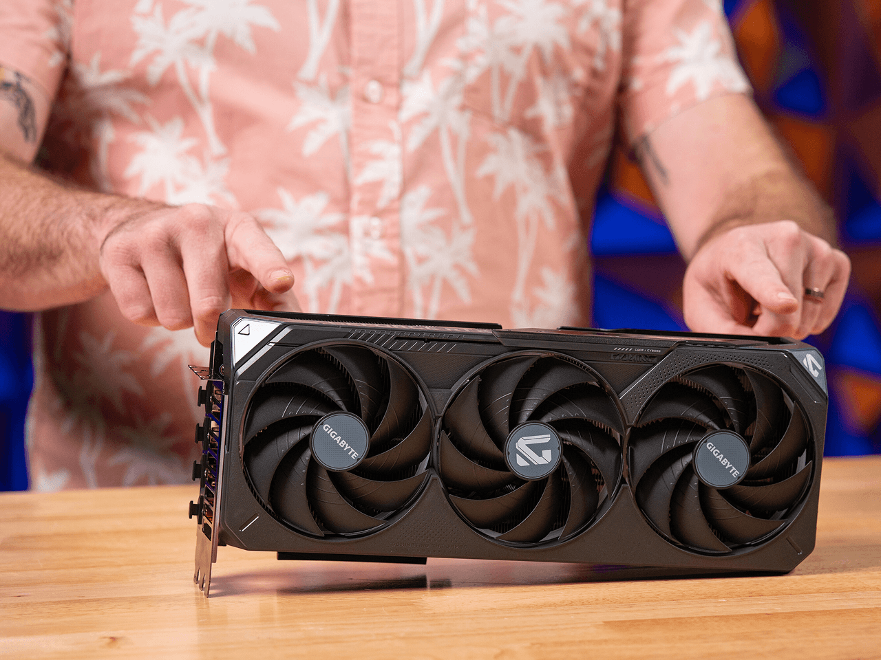 A graphics card being held during a build