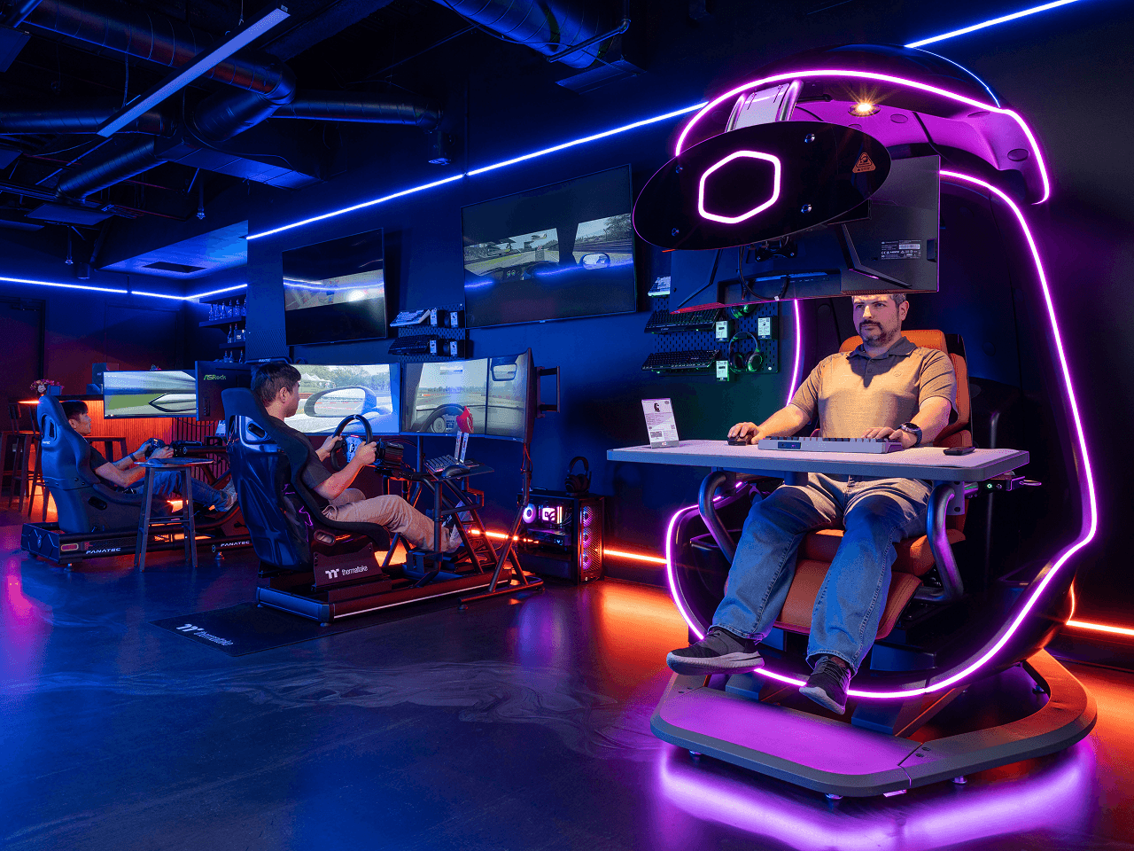 A gaming setup lit with RGB lighting
